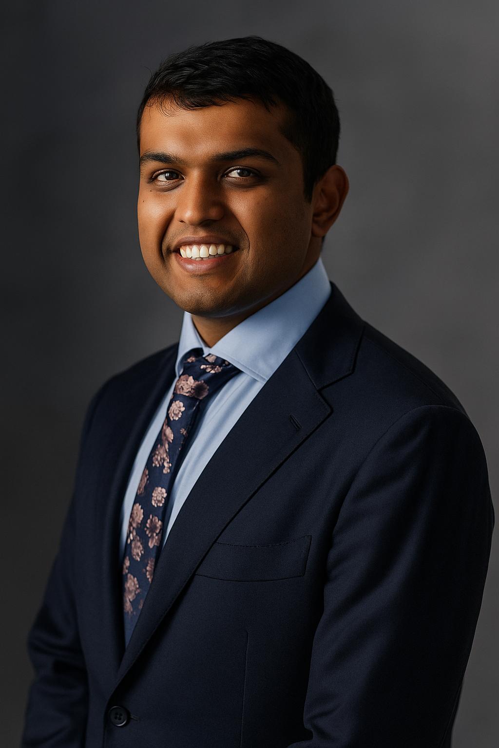 A professional headshot of Kshitij Amin